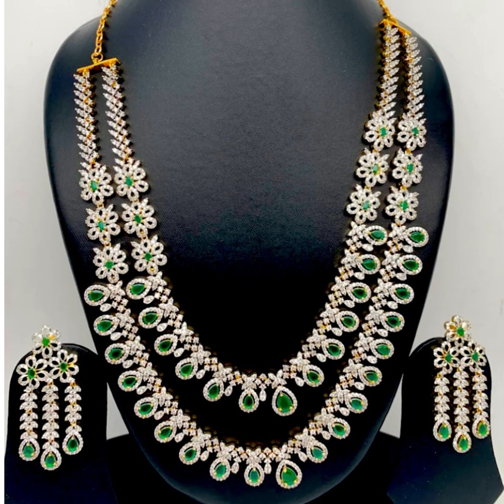 Emerald green stone double layer mid level necklace and matching earrings set.